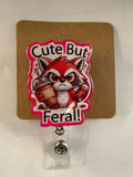 Cute but feral Badge Reel